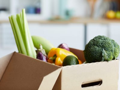 Close-up of fresh vegetables in the cardboard box